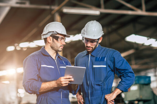 Engineer worker friend people team working discussion help suppo Engineer worker friend people team working discussion help support together at work in heavy industry factory.