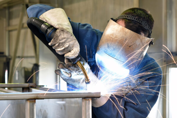 Constructio-welder-works-in-metal-construction---construction-and-processing-of-steel-components