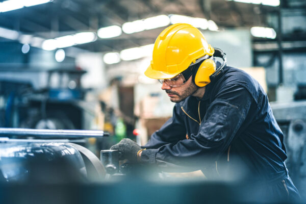 Industrial-Engineers-in-Hard-Hats.-Manufacturing-Factory.-Industrial-worker-indoors-in-factory.-man-working-in-an-industrial-factory.
